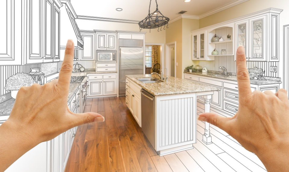 two hands pointing at a kitchen with a drawing of a kitchen