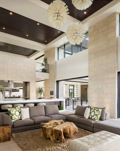 a living room filled with furniture and a chandelier